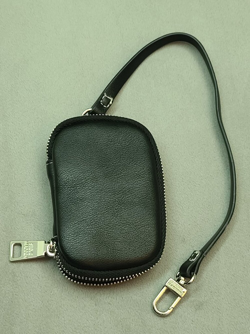 Authentic Steve Madden black textured faux leather mini zip-around pouch